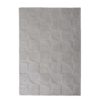 Origins Penny Cream rug with a warm cream tone and carved circular wool texture.