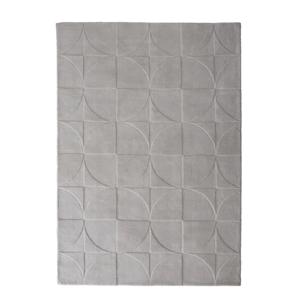 Origins Penny Cream rug with a warm cream tone and carved circular wool texture.