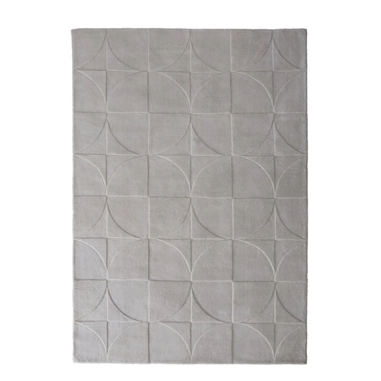 Origins Penny Cream rug with a warm cream tone and carved circular wool texture.