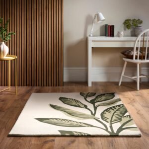 Origins Paradise Leaf rug with layered green leaf detailing and a hand‑carved wool texture on a soft cream base.