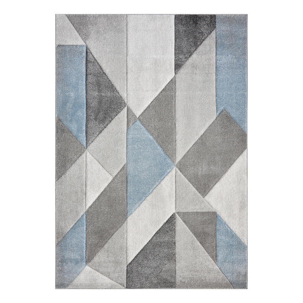 Orbit Alto rug with layered blue tones and a soft textured pattern, styled in a modern interior.