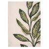 Origins Paradise Leaf rug with oversized green leaf motif and hand‑carved wool texture on an ivory background.