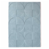 Origins Penny Steel Blue rug in a deep blue tone with a circular carved wool pattern.