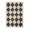 monochrome indoor outdoor rug featuring a striking geometric diamond design