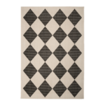 monochrome indoor outdoor rug featuring a striking geometric diamond design