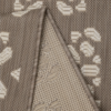 neutral taupe indoor outdoor rug featuring a subtle tile‑effect design