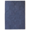 Origins Penny Infinity rug in a cool, airy blue‑grey tone with a carved circular wool pattern.