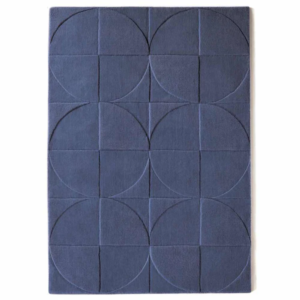 Origins Penny Infinity rug in a cool, airy blue‑grey tone with a carved circular wool pattern.