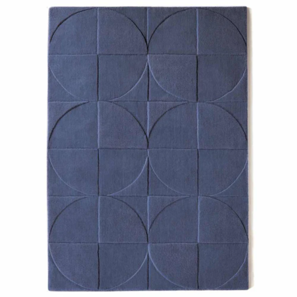 Origins Penny Infinity rug in a cool, airy blue‑grey tone with a carved circular wool pattern.