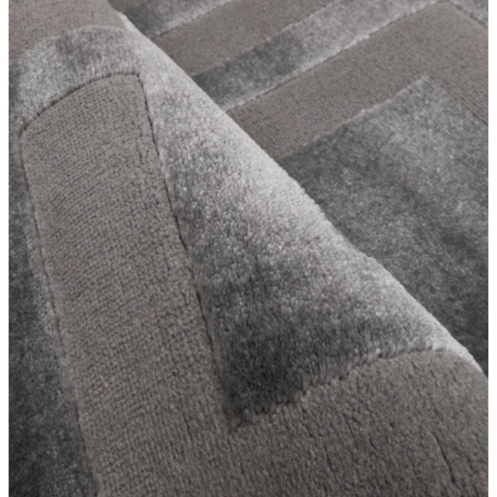 charcoal square‑pattern rug with bold contrast and a modern geometric layout