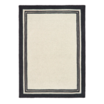 Piper Monochrome rug featuring a bold black border around a soft cream wool centre.