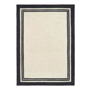 Piper Monochrome rug featuring a bold black border around a soft cream wool centre.