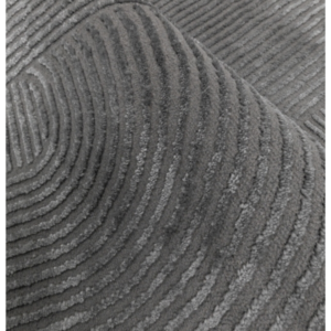 Textured charcoal rug showing soft curved arches and a bold sculpted finish