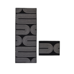 Deco Arch Black geometric rug with bold arch pattern on white background.